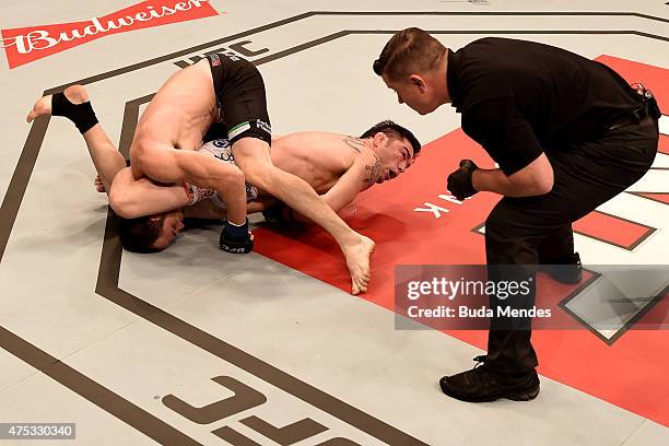 Rony Jason of Brazil and Damon Jackson of the United States in their UFC featherweight bout during the UFC Fight Night Condit v Alves at Arena...