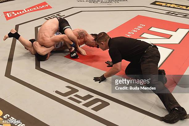 Rony Jason of Brazil submits Damon Jackson of the United States in their UFC featherweight bout during the UFC Fight Night Condit v Alves at Arena...