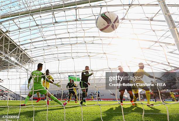 Adam Traore of Mali shoots past Mexican goalkeeper Raul Gudino to score during the FIFA U-20 World Cup New Zealand 2015 Group D match between Mexico...