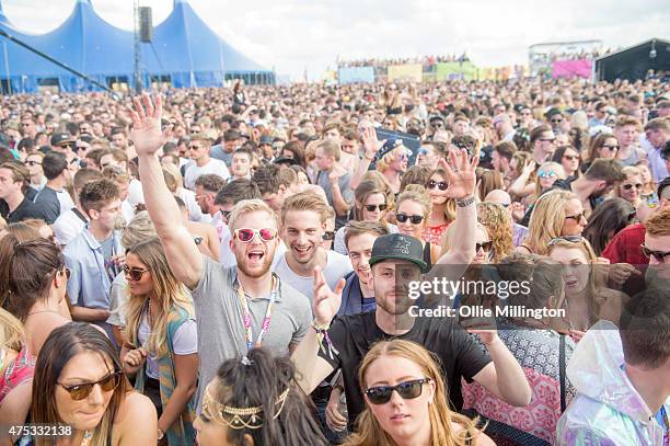 Music fans in the crowd watch on as Gorgon City perform on the main stage during day 1 of We Are FSTVL at Damyns Hall, Upminster on May 30, 2015 in...