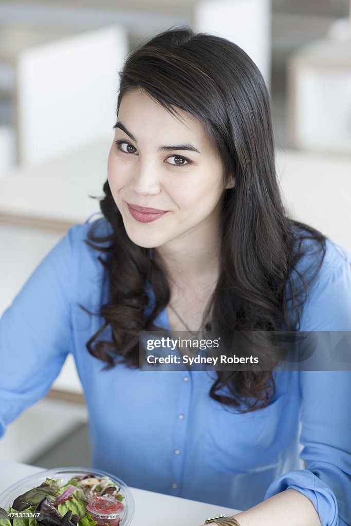 Portrait of smiling businesswoman in cafe