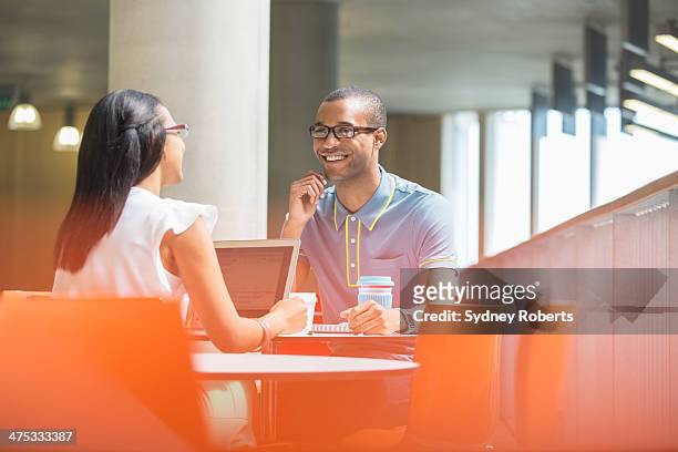 business people having meeting in cafe - conference lobby stock pictures, royalty-free photos & images