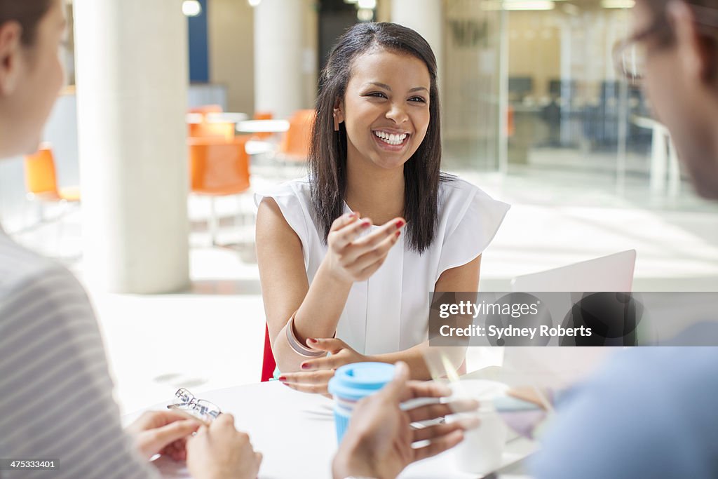 Business people having meeting in cafe