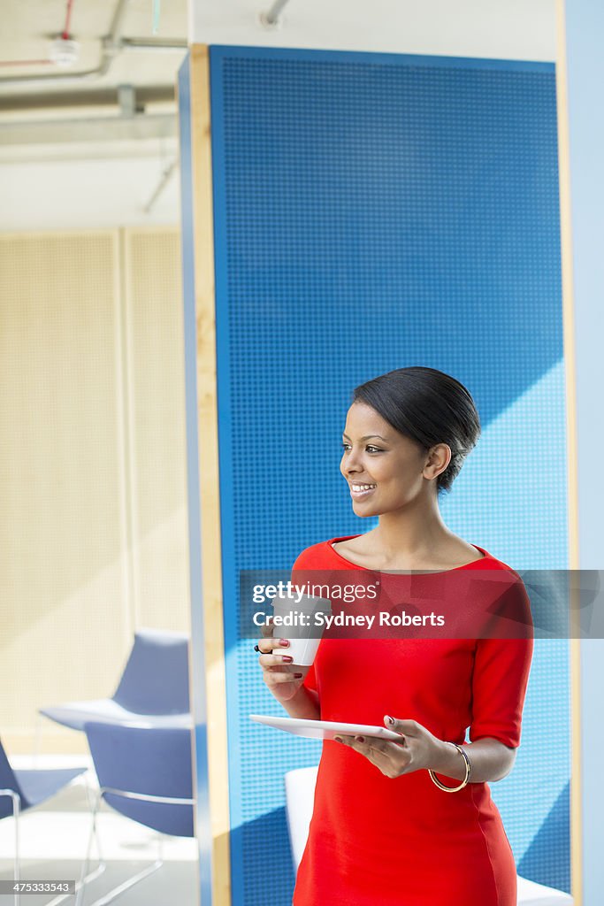 Businesswoman using digital tablet in office