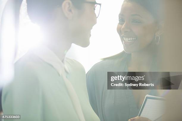 close up of smiling businesswomen in office - gossip stock pictures, royalty-free photos & images
