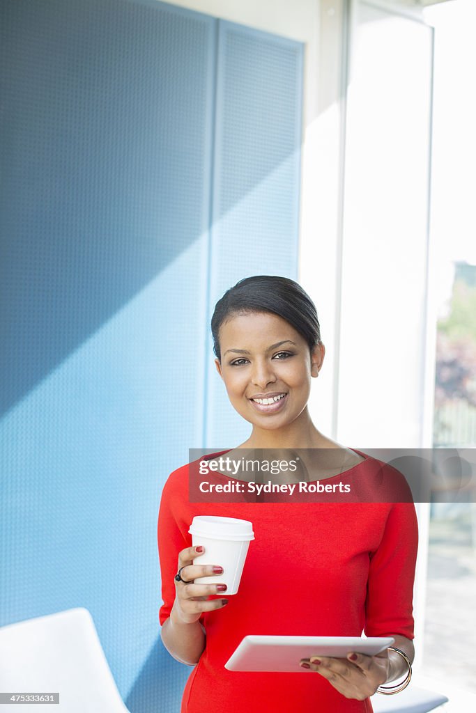 Businesswoman using digital tablet in office