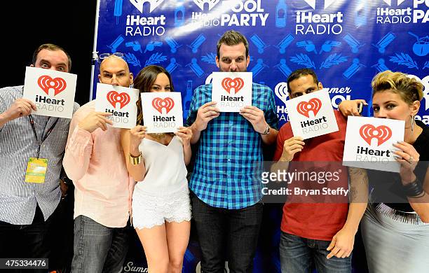 Radio personalities Romeo, DJ JV, Letty B, Brotha Fred, Ramiro Torres and Angi Taylor attend The iHeartRadio Summer Pool Party at Caesars Palace on...