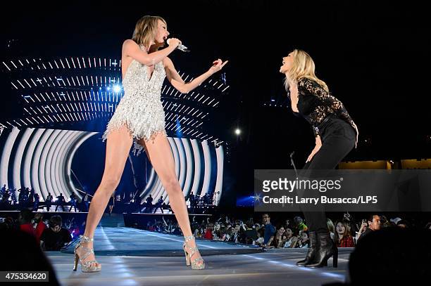 Musician Taylor Swift and model Gigi Hadid perform on stage during the 1989 World Tour Live at Ford Field on May 30, 2015 in Detroit, Michigan.