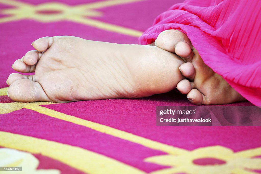 Feet of praying Thai woman