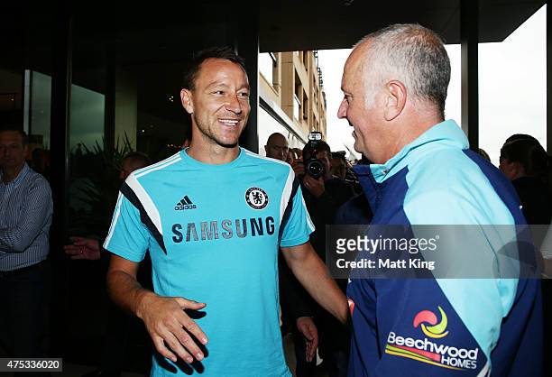 Chelsea FC captain John Terry speaks to Sydney FC head coach Graham Arnold after a press conference at the Park Hyatt Hotel on May 31, 2015 in...