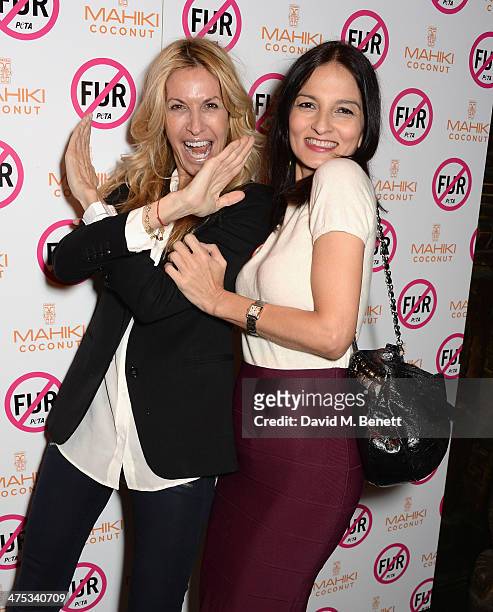 Melissa Odabash and Yasmin Mills attend as PETA host a fur free night at Mahiki on February 27, 2014 in London, England.