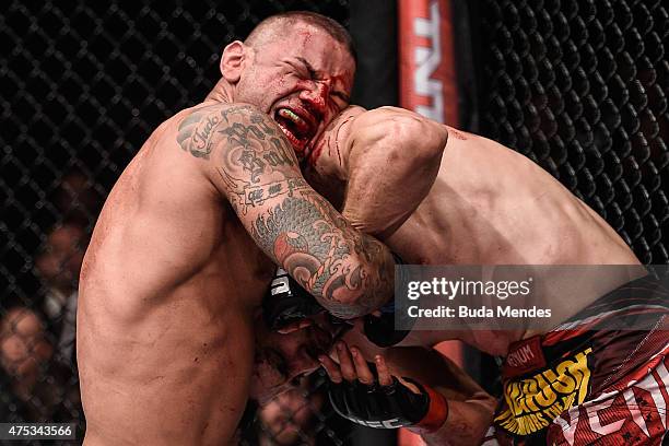 Thiago Alves of Brazil punches Carlos Condit of the United States in their welterweight UFC bout during the UFC Fight Night event at Arena Goiania on...
