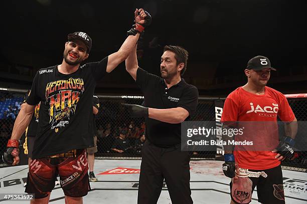 Carlos Condit of the United States celebrates victory over Thiago Alves of Brazil in their welterweight UFC bout during the UFC Fight Night event at...