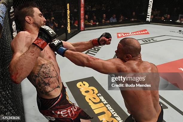 Thiago Alves of Brazil punches Carlos Condit of the United States in their welterweight UFC bout during the UFC Fight Night event at Arena Goiania on...