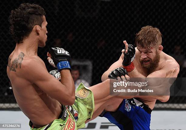 Charles Oliveira and Nick Lentz of the United States exchange kicks in their featherweight UFC bout during the UFC Fight Night event at Arena Goiania...