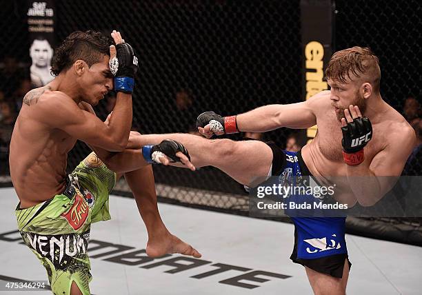 Charles Oliveira and Nick Lentz of the United States exchange kicks in their featherweight UFC bout during the UFC Fight Night event at Arena Goiania...