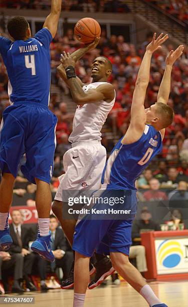 Winston Shepard of the San Diego State Aztecs shoots the ball in the second half of the game between defenders Kamryn Williams and Marek Olesinski of...