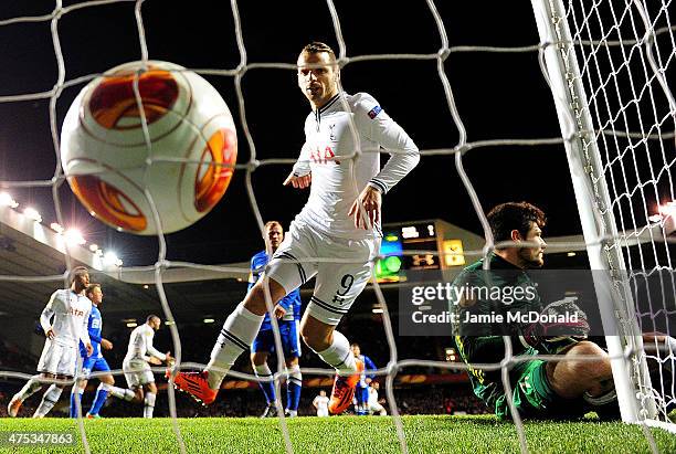 Roberto Soldado of Tottenham Hotspur watches the ball hit the back of the net after Christian Eriksen of Tottenham Hotspur scores the first goal from...