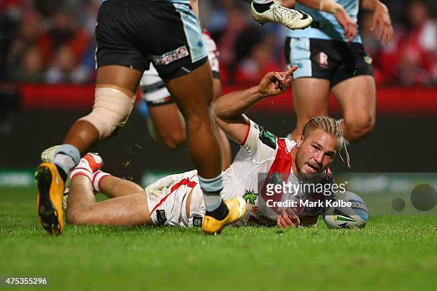 Jack de Belin of the Dragons celebrates scoring a try during the round 12 NRL match between the St George Illawarra Dragons and the Cronulla Sharks...