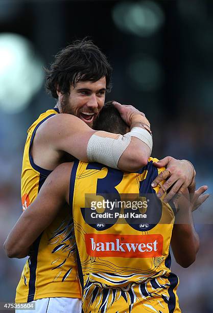 Josh Kennedy of the Eagles congratulates Josh Hill after kicking a goal during the round nine AFL match between the West Coast Eagles and the Geelong...