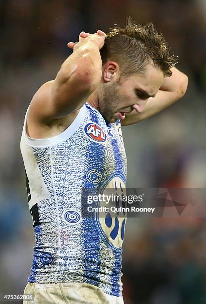 Jamie MacMillan of the Kangaroos looks dejected after losing the round nine AFL match between the Collingwood Magpies and the North Melbourne...