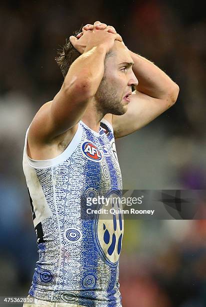 Jamie MacMillan of the Kangaroos looks dejected after losing the round nine AFL match between the Collingwood Magpies and the North Melbourne...