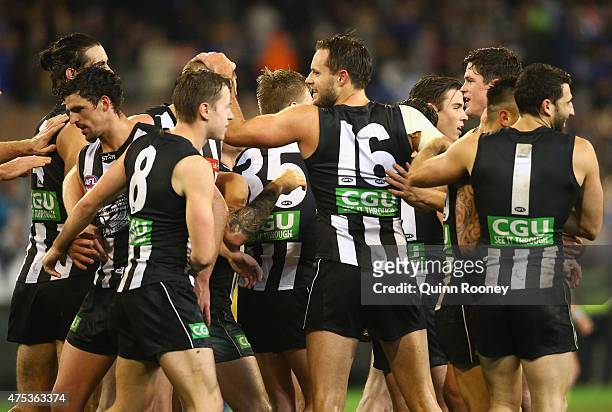 Magpies players celebrate winning the round nine AFL match between the Collingwood Magpies and the North Melbourne Kangaroos at Melbourne Cricket...