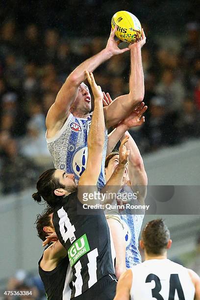 Todd Goldstein of the Kangaroos marks over the top of Brodie Grundy of the Magpies during the round nine AFL match between the Collingwood Magpies...