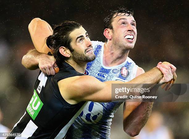 Brodie Grundy of the Magpies and Todd Goldstein of the Kangaroos contest for a mark during the round nine AFL match between the Collingwood Magpies...