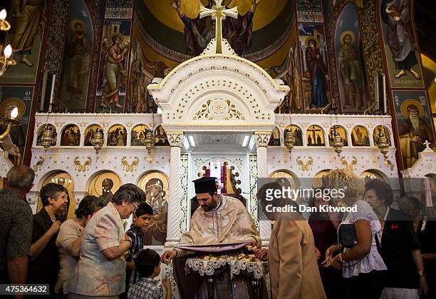 Church goers celebrate Pentecost at The Church of St Paul, on May 31, 2015 in Kos, Greece. Pentecost marks the descent of the Holy Spirit on the...