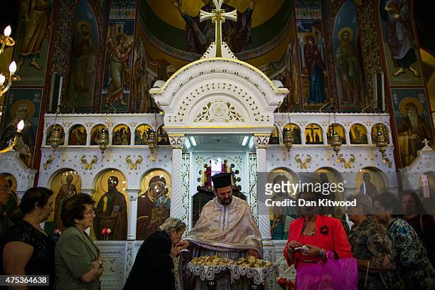 Church goers celebrate Pentecost at The Church of St Paul, on May 31, 2015 in Kos, Greece. Pentecost marks the descent of the Holy Spirit on the...