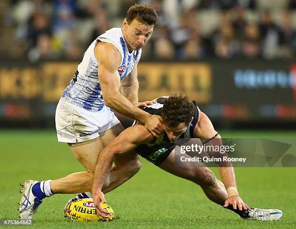 Brent Harvey of the Kangaroos and Jarryd Blair of the Magpies compete for the ball during the round nine AFL match between the Collingwood Magpies...