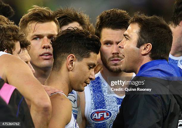 Brad Scott the coach of the Kangaroos talks to his players during the round nine AFL match between the Collingwood Magpies and the North Melbourne...