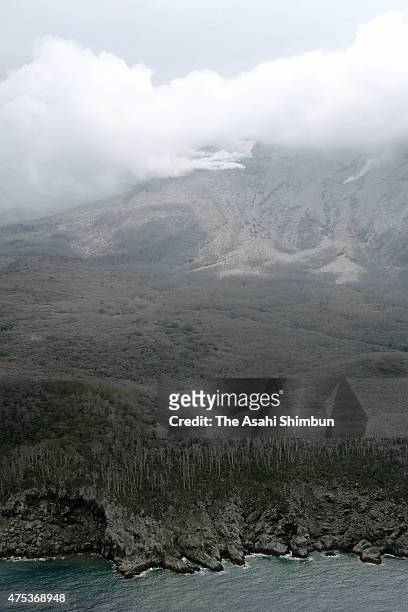 In this aerial image, volcanic ash spews from Mount Shindake of Kuchinoerabu Island on May 30, 2015 in Yakushima, Kagoshima, Japan. All residents of...