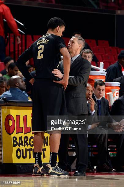Head coach Jeff Bzdelik of the Wake Forest Demon Deacons talks with Devin Thomas during the game against the Maryland Terrapins at the Comcast Center...