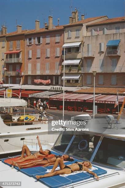 Holidaymakers lounging on the deck of their luxury yacht in Saint-Tropez, France, August 1971.