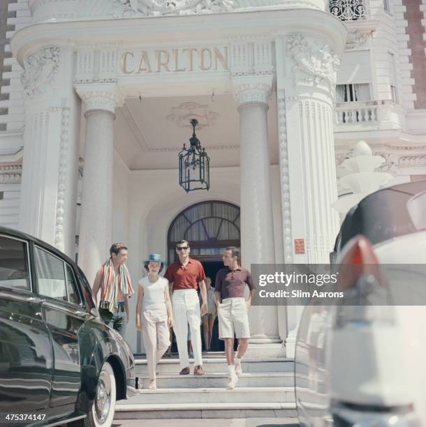 Guests at the entrance to the Carlton Hotel, Cannes, France, 1958.