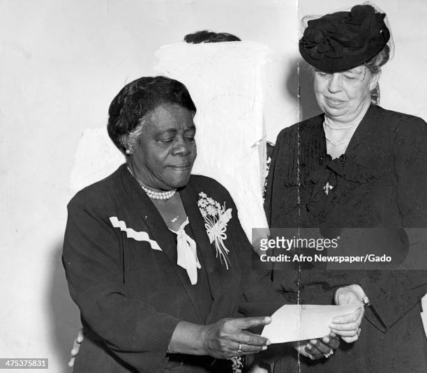 Half length portrait of First Lady Eleanor Roosevelt with Mary McLeod Bethune and Nell Hunter , 1940.