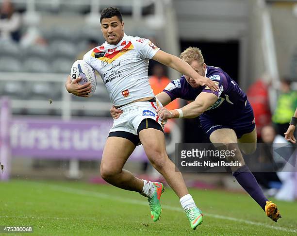 Fouad Yaha of Catalans Dragons tackled by Aaron Murphy of Huddersfield Giants during the Super League match between Catalans Dragons and Huddersfield...