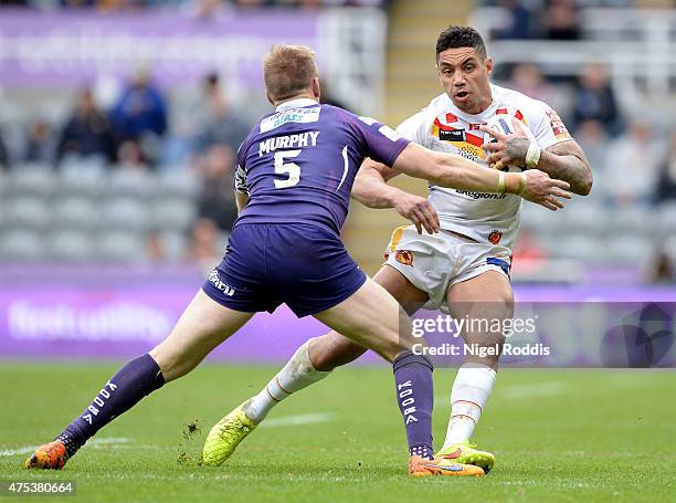 Willie Tonga of Catalans Dragons tackled by Aaron Murphy of Huddersfield Giants during the Super League match between Catalans Dragons and...