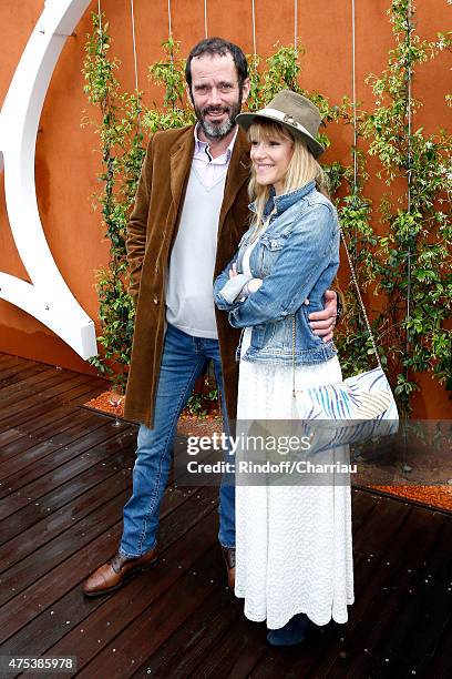 Actor Christian Vadim and his wife Julia Livage attend the 2015 Roland Garros French Tennis Open - Day Eight, on May 31, 2015 in Paris, France.
