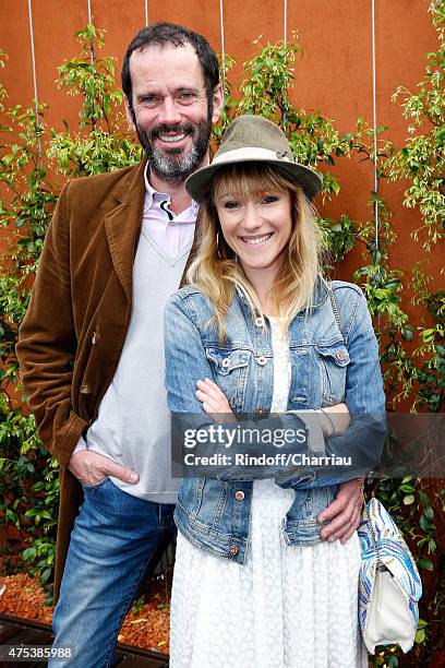 Actor Christian Vadim and his wife Julia Livage attend the 2015 Roland Garros French Tennis Open - Day Eight, on May 31, 2015 in Paris, France.