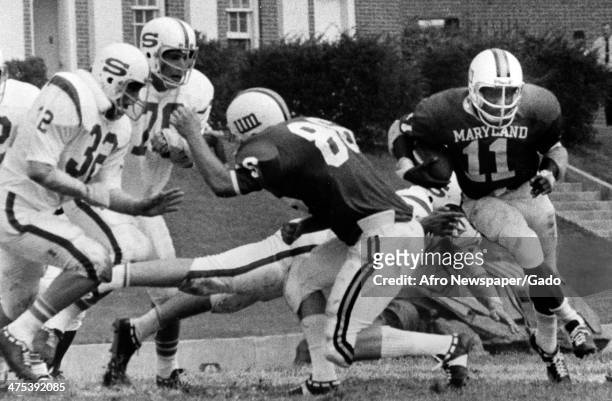 Football players, including Art Seymour, during a game with University of Maryland football team, Baltimore, Maryland, 1980.