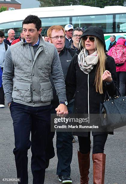 Rory McIlroy of Northern Ireland arrives at the course with new girlfriend Erica Stoll during the fourth round of the Dubai Duty Free Irish Open...