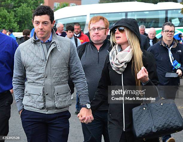Rory McIlroy of Northern Ireland arrives at the course with new girlfriend Erica Stoll during the fourth round of the Dubai Duty Free Irish Open...