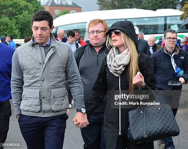 Rory McIlroy of Northern Ireland arrives at the course with new girlfriend Erica Stoll during the fourth round of the Dubai Duty Free Irish Open...