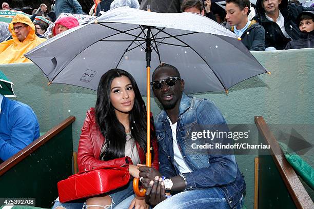 France and Liverpool professional footballer Mamadou Sakho and his companion Matja attend the 2015 Roland Garros French Tennis Open - Day Eight, on...