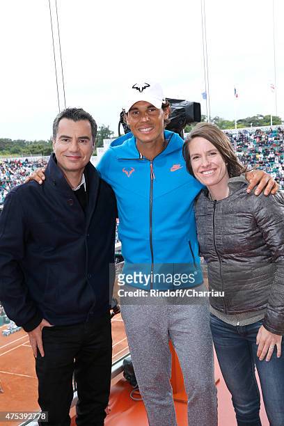 Sports journalist Laurent Luyat, Tennis Player Rafael Nadal and Former Tenis player Justine Henin pose at France Television french chanel studio...