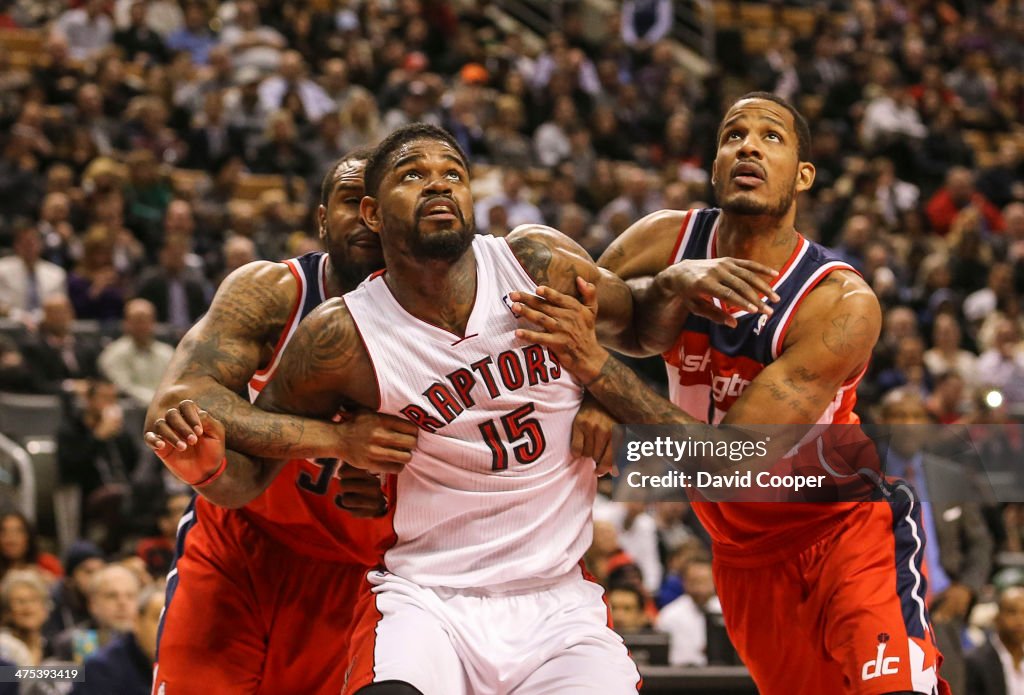 Toronto Raptors power forward Amir Johnson (15) battle for position with Washington Wizards power forward Trevor Booker (35) and Wizards small forward Trevor Ariza (1)