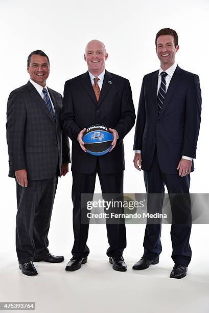 Orlando Magic CEO Alex Martins, new Magic head coach Scott Skiles and General Manager Rob Hennigan pose for a portrait on May 29, 2015 at Amway...